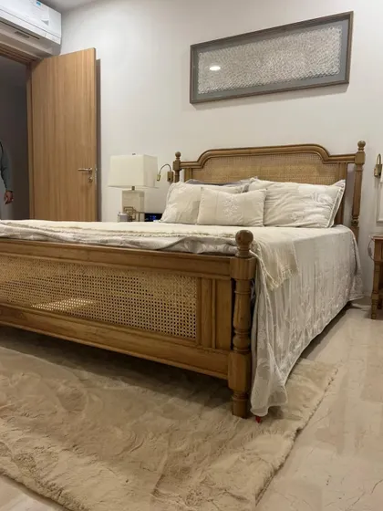 Another angle of the custom oak and cane bed in the client's bedroom.