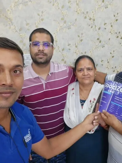 Our team with a happy couple and their parents, all ready to enjoy the benefits of solar energy.