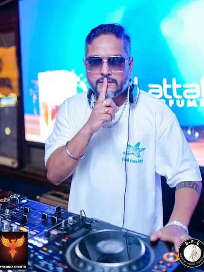 The 'shhh' pose before dropping a surprise track. This was taken at DRAVA Bar & Kitchen during the "Talk of the Town" party, keeping the crowd on their toes.