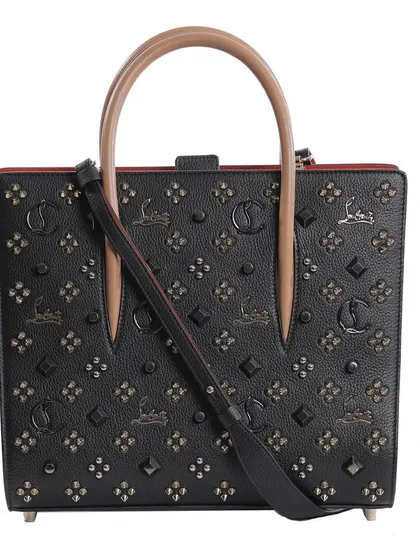 This image shows the Louboutin bag with its crossbody strap attached, demonstrating the product's versatility for an online listing.