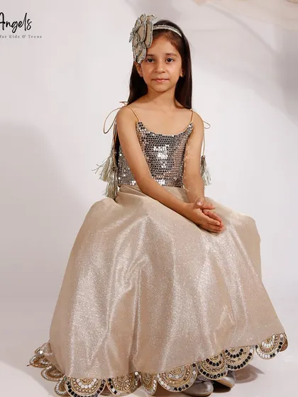 A golden sequin top and brocade skirt, showing how we mix textures and fabrics.