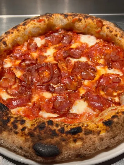 A spicy salami pizza, fresh out of our pizza trials. We're always experimenting to bring you the best flavours.