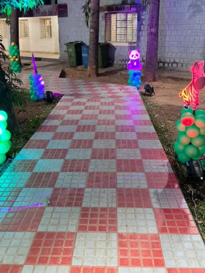 Another view of the outdoor pathway decor, showing the colorful, lit-up animal cutouts that add a playful element to the entrance.