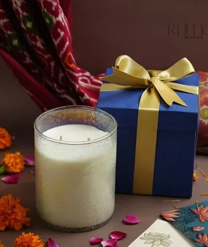 My luxury jar candle, presented in a beautiful navy box with a golden ribbon. The textured glass jar looks stunning when lit, making it a perfect high-end gift.