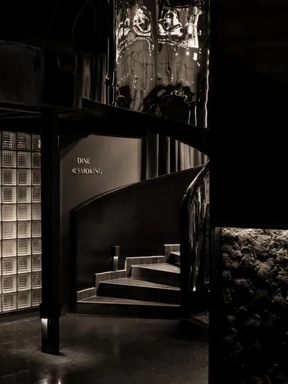 A collection of atmospheric shots from Lair, showcasing the interplay of black concrete, glass blocks, polished steel, and dramatic lighting. Each image captures a fragment of the bar's mysterious and immersive character.