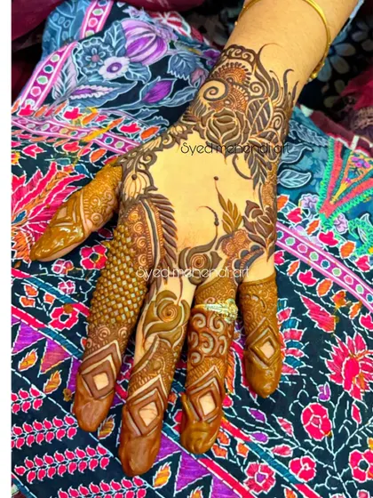 A single-hand design with intricate finger work and a floral wristband.