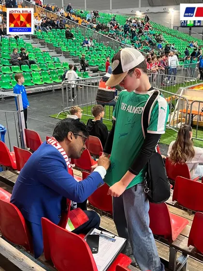 Signing an autograph for a young German fan at the MTU Cup. It was heartwarming to see the local support and interest in our team from India.