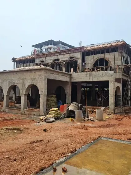 Another angle of the Veerabhavana Villa under construction. This view shows the full scope of the corner plot and how the design addresses both street-facing elevations, a key consideration from the start.