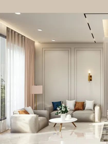A bright and airy living space designed with a neutral color palette to maximize the feeling of calm. I used classic wall molding, sheer curtains to diffuse natural light, and a mix of textures in the furniture to add warmth and sophistication.