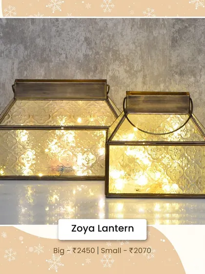 The Zoya Lantern features beautiful textured glass that diffuses light for a soft, magical glow. I love filling it with fairy lights for a festive look.