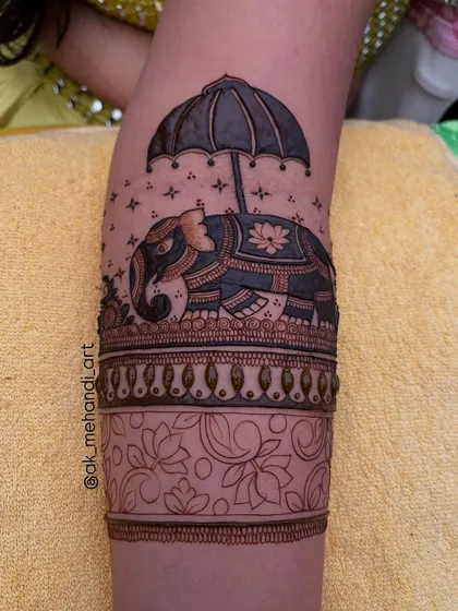 Here you can see the elephant design with the floral band below it still in outline form. This shows the step-by-step process of building a complex design.