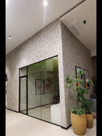 A corner view of the office mural, showing how the pattern wraps around the room, creating an immersive experience.