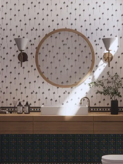 This bathroom in our Goa project has a playful, tropical feel. I used a palm tree-patterned wallpaper and vibrant blue-green tiles to create a space that is fun, fresh, and perfect for a holiday home.