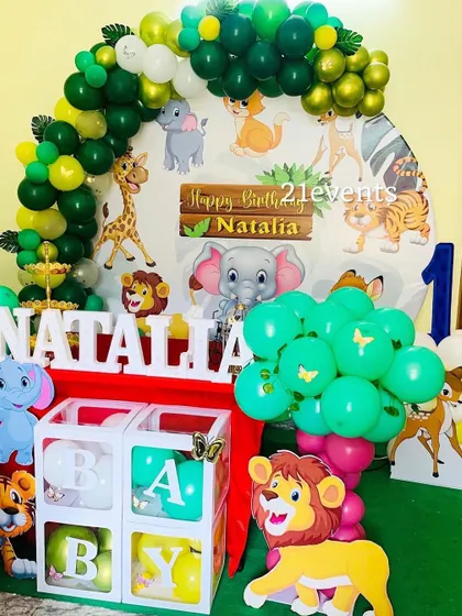 A cute cartoon jungle theme with 'BABY' blocks, perfect for a first birthday.