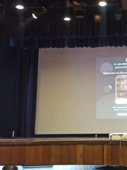 My presentation slide visible on the large screen during the interactive session at S.S. Jain Subodh Law College.
