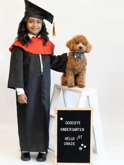 Goodbye Kindergarten, Hello 1st Grade. We love capturing important academic milestones like this kindergarten graduation. It is a proud moment for the family, and we were thrilled to document it, complete with her furry friend.