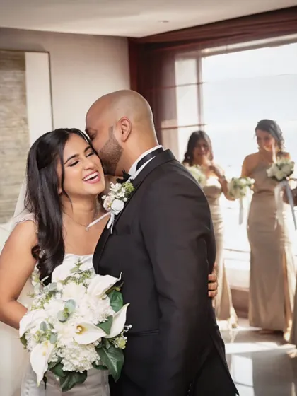 A moment of pure laughter and joy. The bride's happiness is the most beautiful thing, and her makeup stayed flawless through it all.