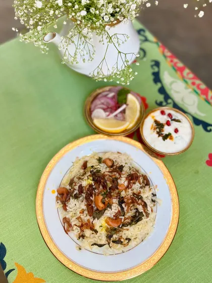 Our Malabar Chicken Biryani, a star of the Iftar menu. This dish combines Arab influences with Kerala's spice coast flavors, using a slow-cooked dum technique for a truly satisfying result.