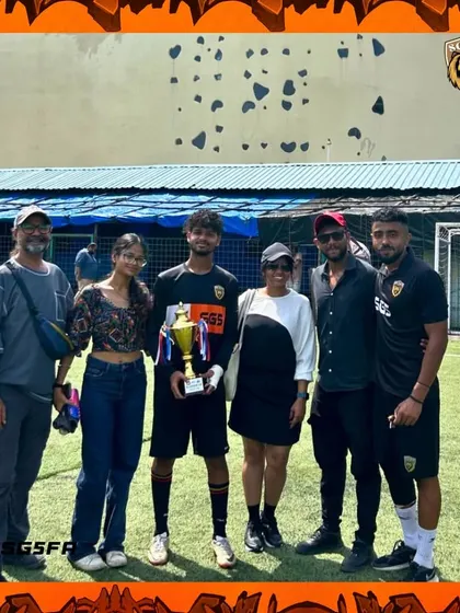 A player with his family and coaches after the tournament. It takes a village to build a champion, and this is our village.