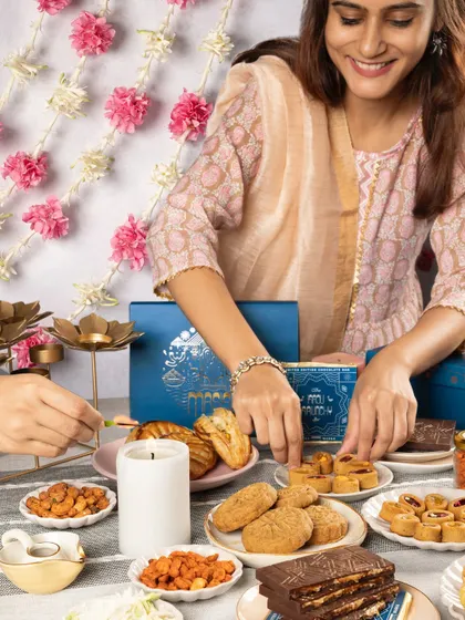 Arranging the final touches on a Diwali gift table. Our collection makes for the perfect, delicious present.