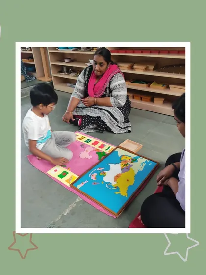 A teacher assists as Aarav presents his work to his mother. This collaborative approach ensures that parents are active participants in their child's educational journey.