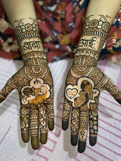 A clear, full view of the maternity-themed mehandi, showcasing the portrait work and surrounding traditional patterns.