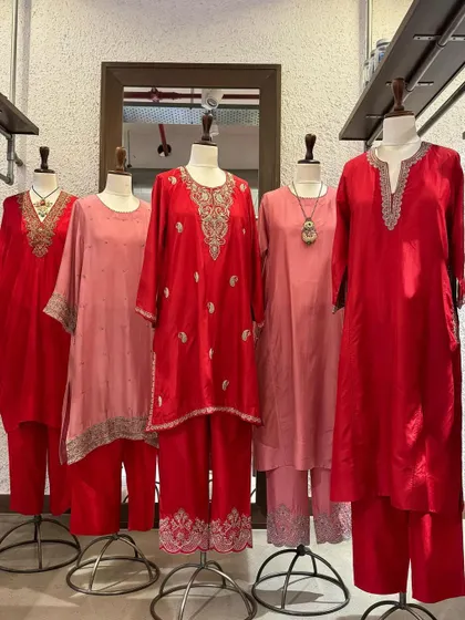 A beautiful array of red and pink silk kurtas from Brih, each featuring unique and delicate silver embroidery.