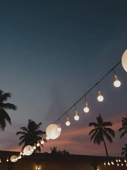 Simple string lights and paper lanterns against a twilight sky. This type of lighting is one of our favorite ways to create a magical and relaxed atmosphere for outdoor evening events.