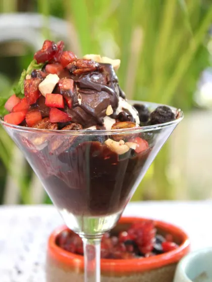 A different angle of our decadent chocolate sundae, showcasing the layers of brownie, ice cream, and fresh fruit toppings.