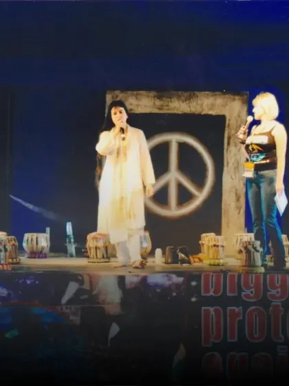 A throwback to my performance at the Woodstock Festival in 2008, where I performed for an audience of 400,000 fans. I stood on stage with a peace sign, sharing the message of harmony through the universal language of music.