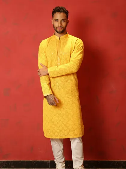 When you're invited to a friend's Haldi, a yellow kurta is the only way to go. This embroidered yellow kurta ensures you'll shine just as bright as the groom.