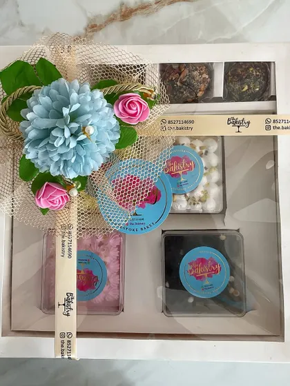 A beautifully assembled Diwali hamper, showcasing a mix of our signature desserts. This box is perfect for gifting to friends, family, or colleagues, offering a taste of our unique, handcrafted sweets.