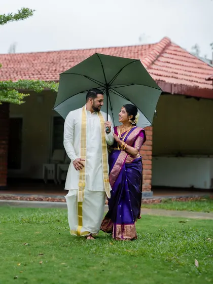 A romantic stroll in the rain. We embrace every element of the wedding day, even a little monsoon magic, to create unique and memorable couple portraits.