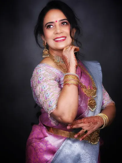 This close-up shot highlights the client's radiant smile and the subtle yet impactful makeup that enhances her natural features.