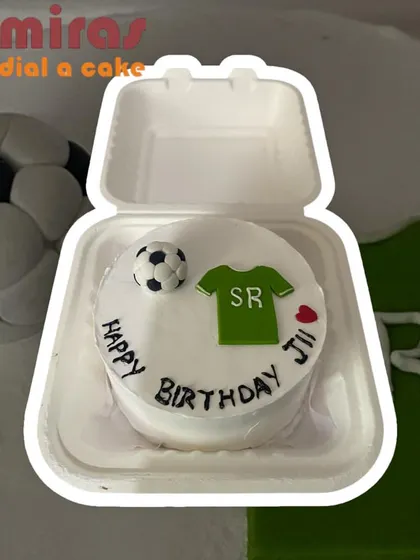 Bento cakes can be themed for any hobby, like this one for a football fan's birthday. It includes a small jersey, a football, and a personalized birthday message, making it a great individual gift.