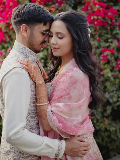 A romantic, intimate portrait of the couple, finding a quiet moment together during their Mehendi celebration.
