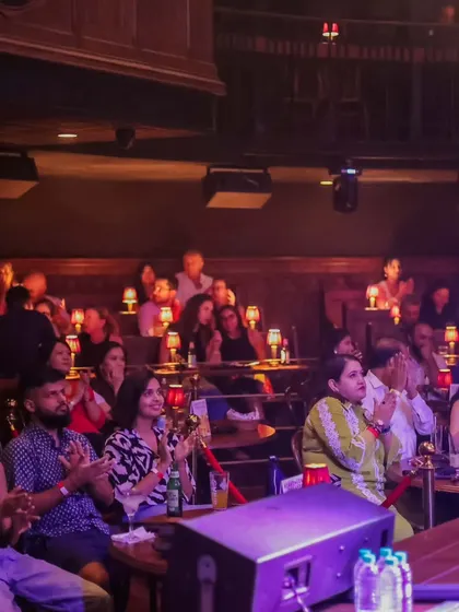 A packed house at The Piano Man enjoying David Walters' concert. This shows that our cultural events extend beyond our campus, collaborating with popular venues across Delhi.