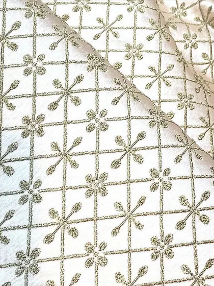This geometric patterned fabric in a neutral tone provides a modern yet traditional look for a custom Indo-Western jacket or kurta.