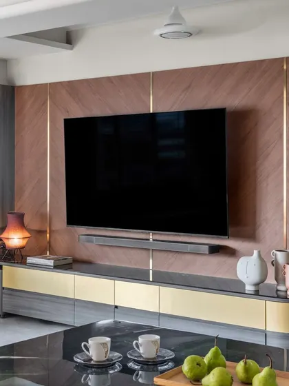 This contemporary TV unit is all about clean lines and a touch of glam. I designed it with seamless, hidden storage to keep wires and clutter out of sight, and added brass accents for warmth.