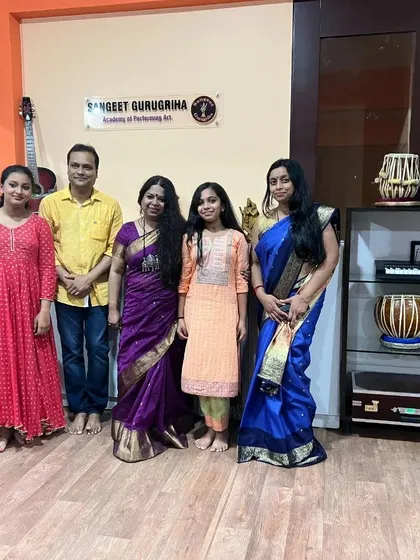 Posing for a photo with the examination panel, a moment of pride for our students and teachers.