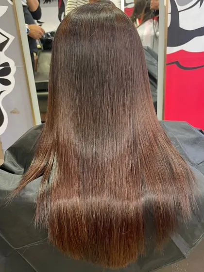 A student's work showcasing a smooth, sleek hair straightening result. I teach the proper techniques for chemical treatments to ensure the hair remains healthy and shiny.