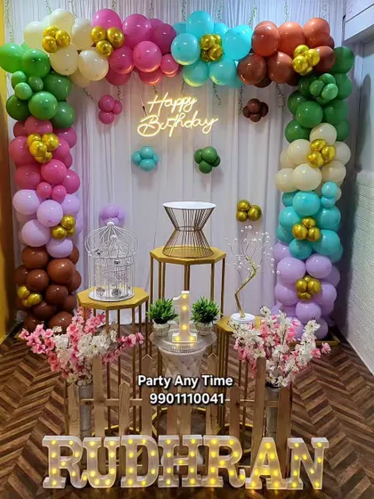 A colorful balloon arch with a variety of bright colors, perfect for a lively birthday party.