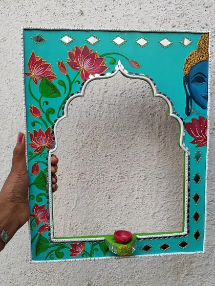 A new design I tried, combining a Buddha painting with a Jharokha-style mirror and a small candle holder.