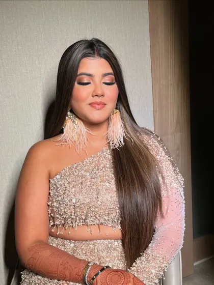 A close up with her eyes closed, showing the soft, blended smokey eye.