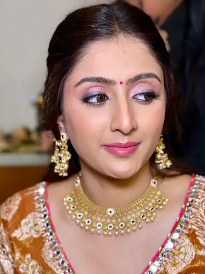 Another angle of this soft and traditional look, showing the beautiful details of her jewelry and the clean, elegant makeup.