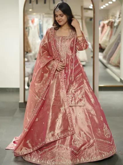 Not your usual ethnic, but definitely unforgettable. This shimmering pink sharara set has a unique texture and a regal feel.