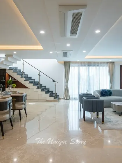 A complete view of the open-concept living and dining area, showcasing the seamless integration of different functional zones. The design emphasizes space, light, and a cohesive modern contemporary aesthetic.