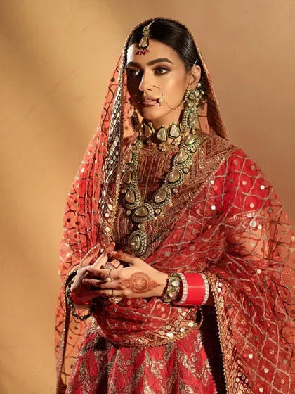 A classic North Indian bridal look with a focus on rich, warm tones. You'll learn how to create this dramatic eye makeup and pair it with traditional jewelry like the nath and maang tikka for an authentic feel.