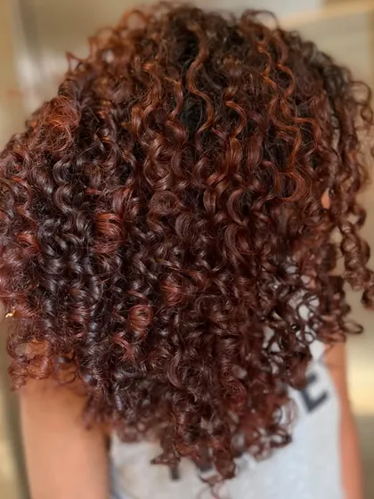 The after shot. This Pumpkin Spice color is perfect for fall, and the curls are now defined, hydrated, and full of life.