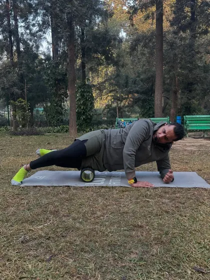 Using a foam roller on my IT band. I teach my clients the importance of self-myofascial release for recovery and injury prevention.
